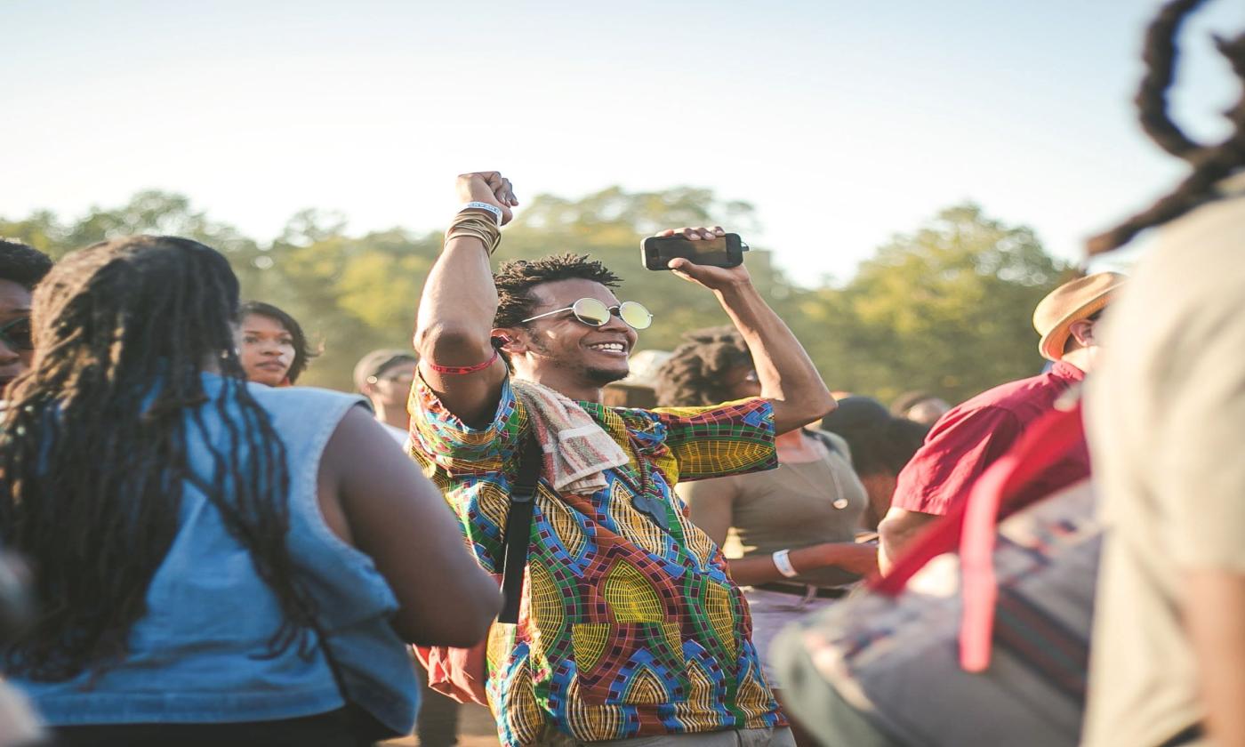People celebrate at a concert.