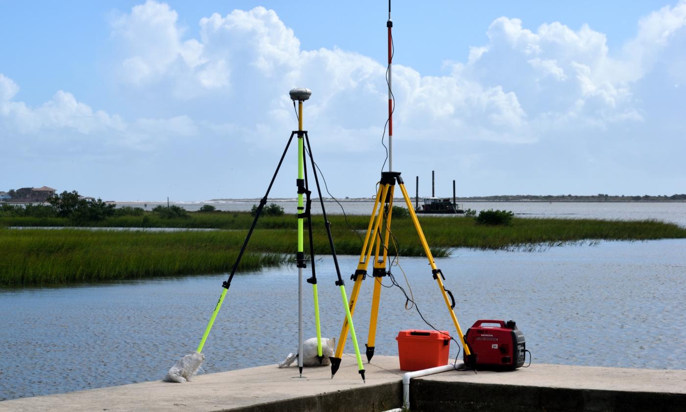 Land surveyors equipment overlooking river
