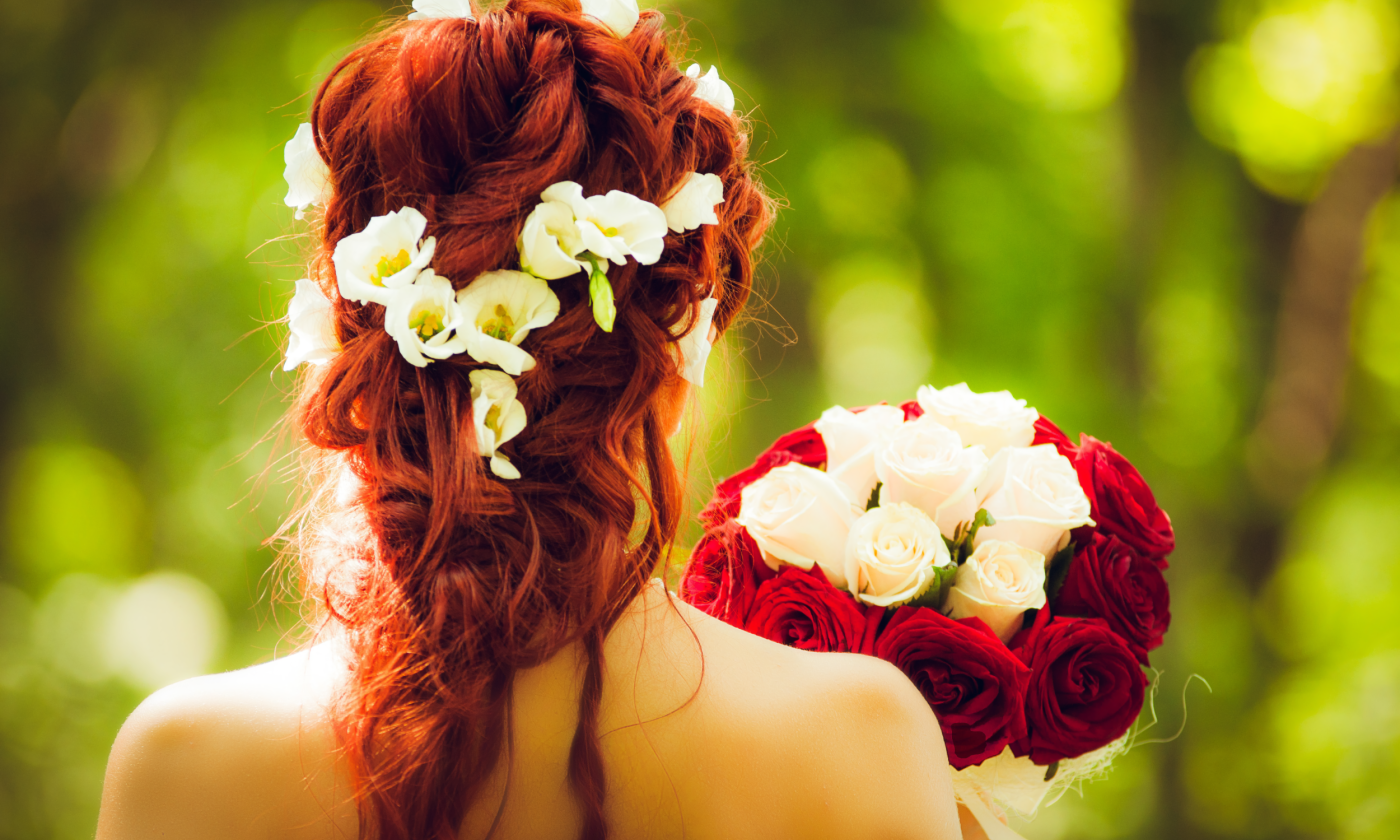 A bride holds a bouquet. 