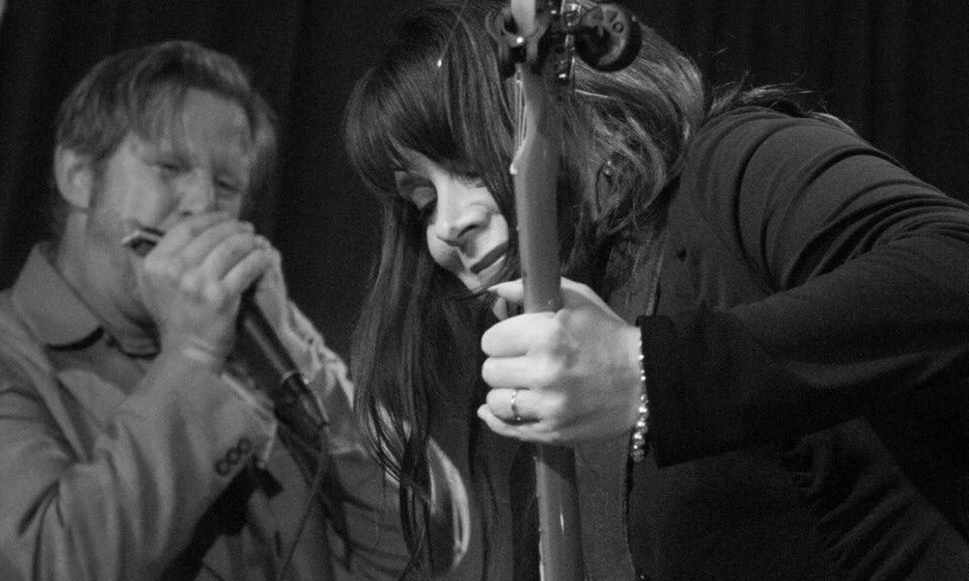 Carolyn Wonderland plays a musical instrument.