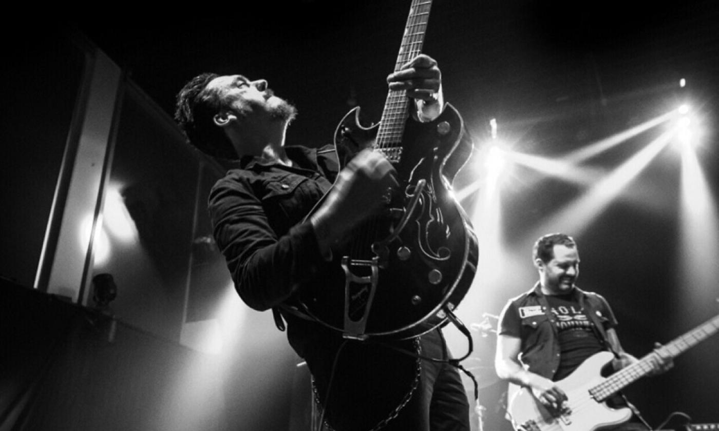 Jesse Dayton sings and plays his guitar. 