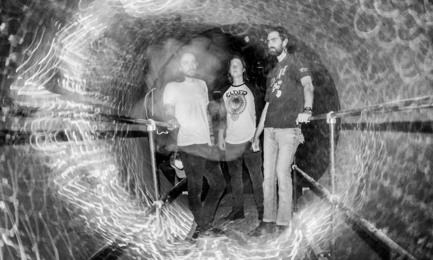 King Buffalo poses with a psychedelic backdrop.