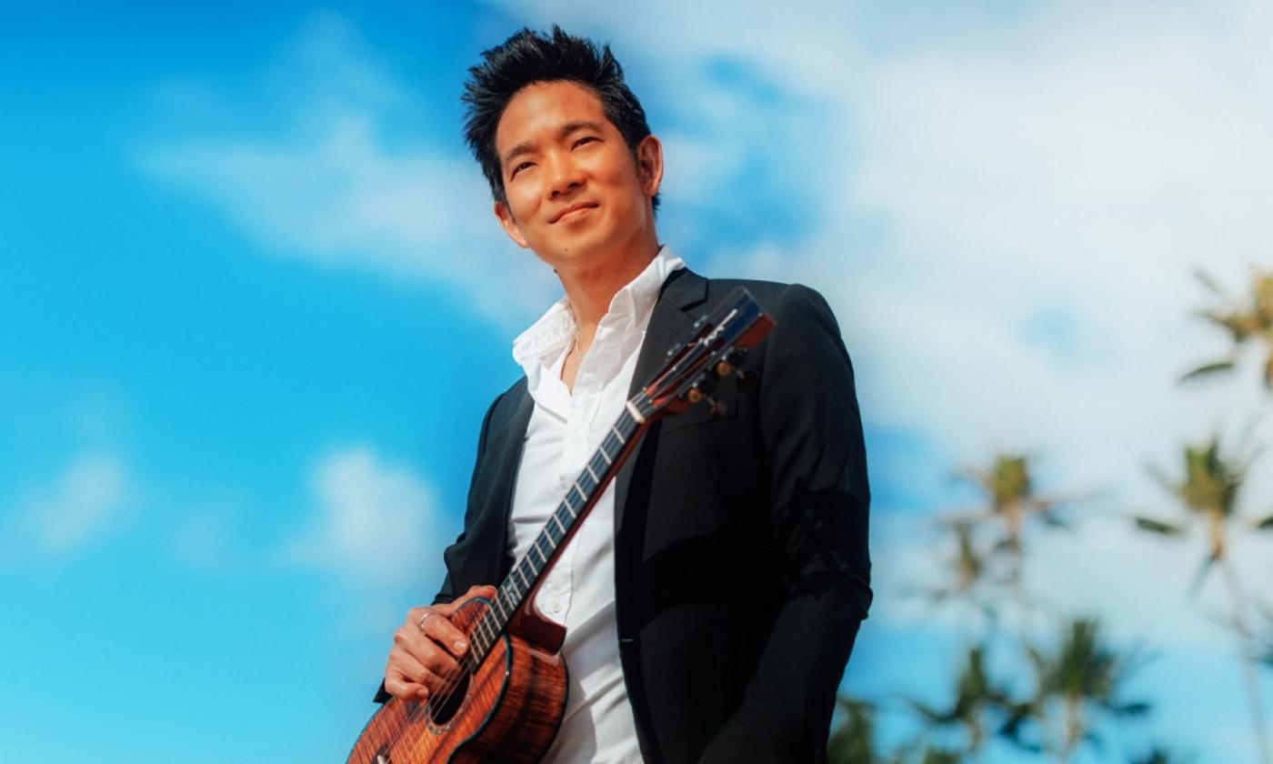 Jake Shimabukuro poses with his ukelele. 