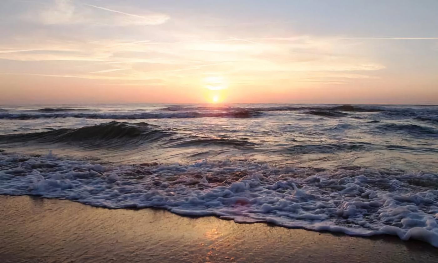 Sun on the horizon at Crescent Beach in St. Augustine, Florida