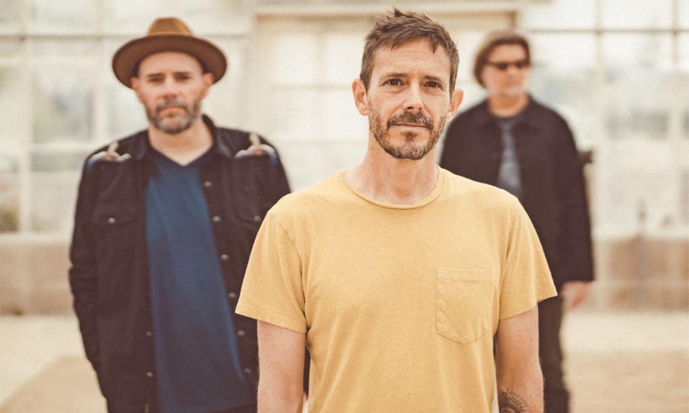 Members of Toad the Wet Sprocket smile and pose for the camera.