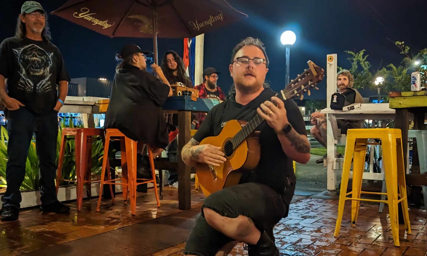 Noah Eagle kneels epically on the patio of Shanghai Nobby's, where local freaks gather for live music.