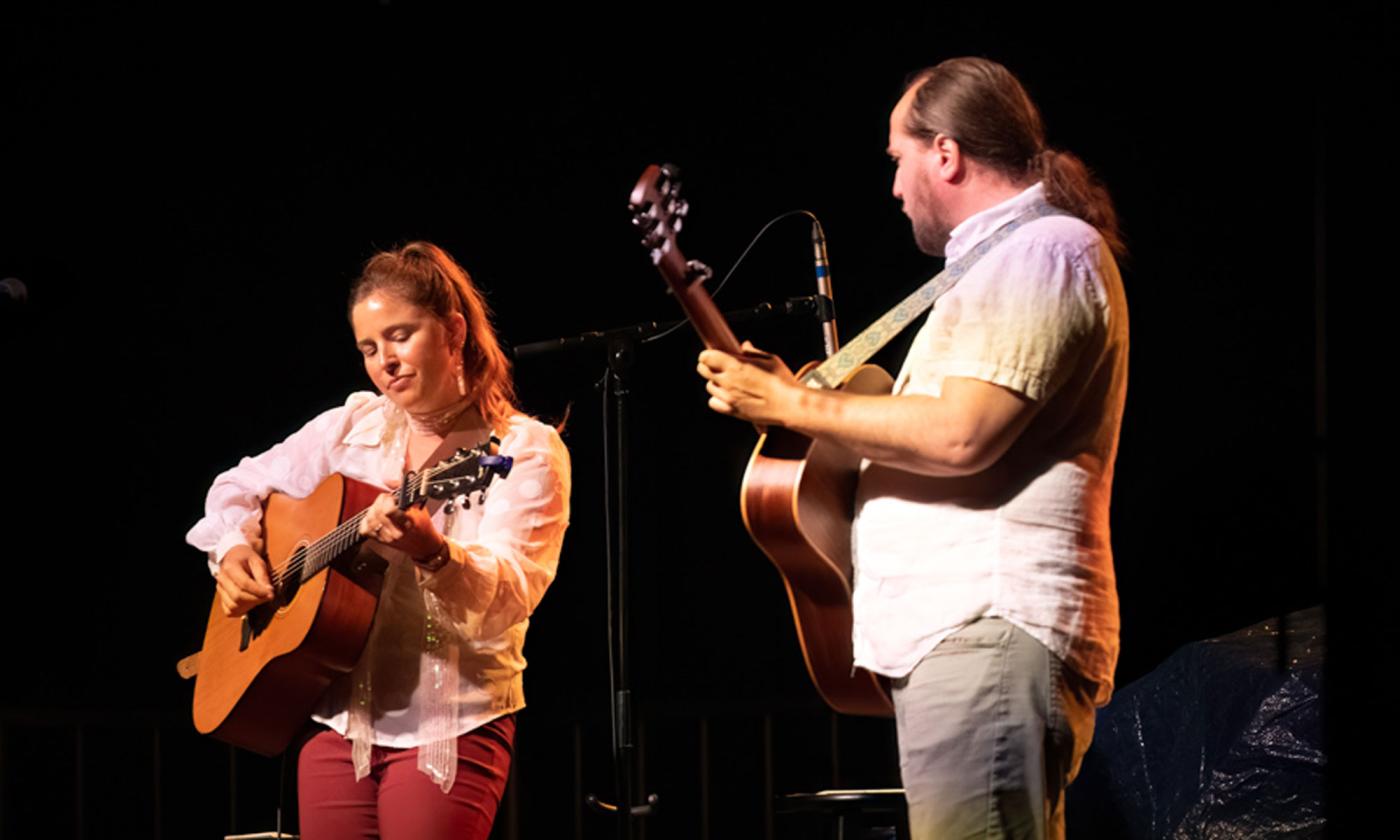 Aslyn Barringer and Jim Johnston playing guitars