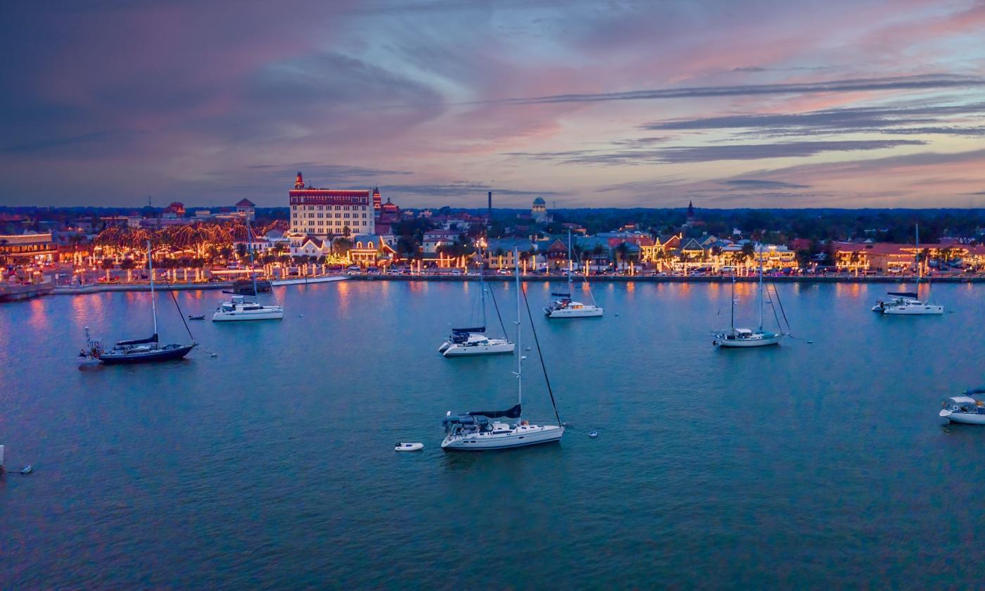 This drone footage captured by St. Augustine Sailing shows the holiday lights against a vibrant sunset
