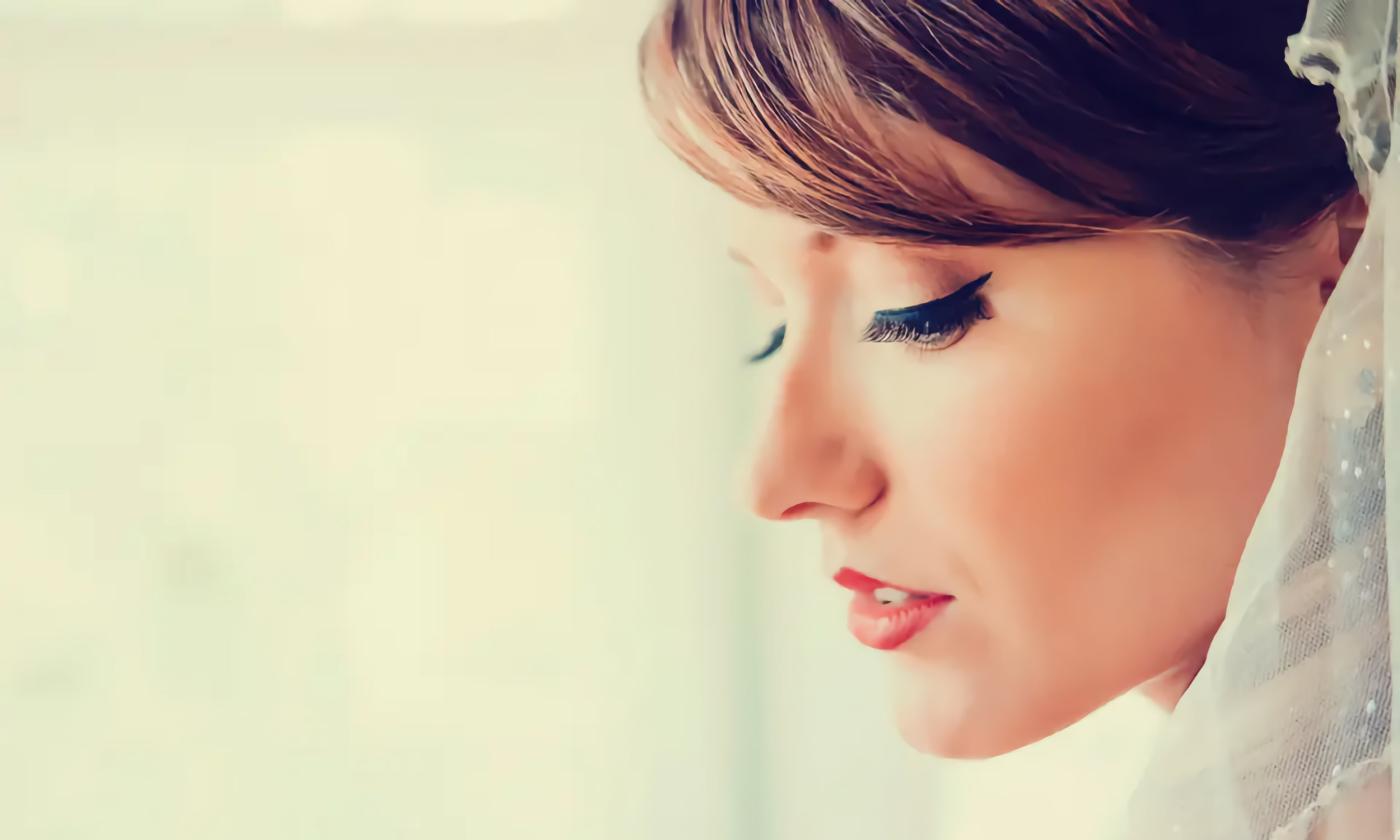 A bride wearing makeup by Christine Burns