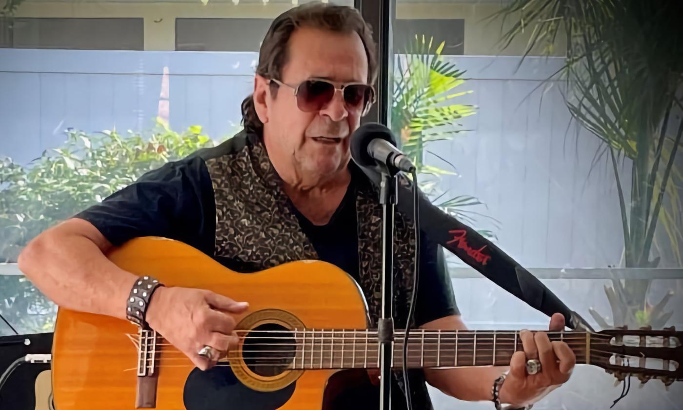 Luis Mario Peral playing Latin jazz on an acoustic-electric guitar
