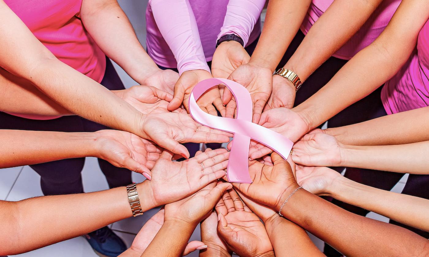 Women joining together to support breast cancer awareness