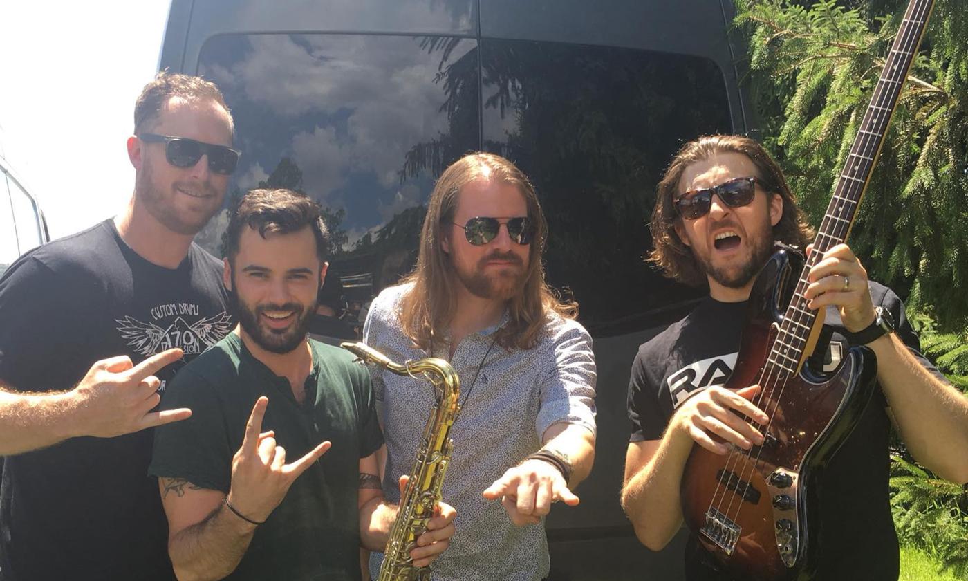The band Stolen Rhodes with saxophone and guitar, hamming it up in New Jersey