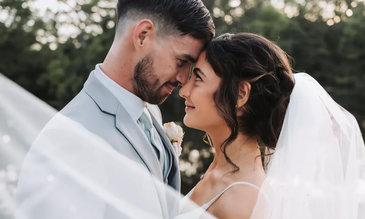 Bride and Groom touching foreheads and staring into each other's eyes