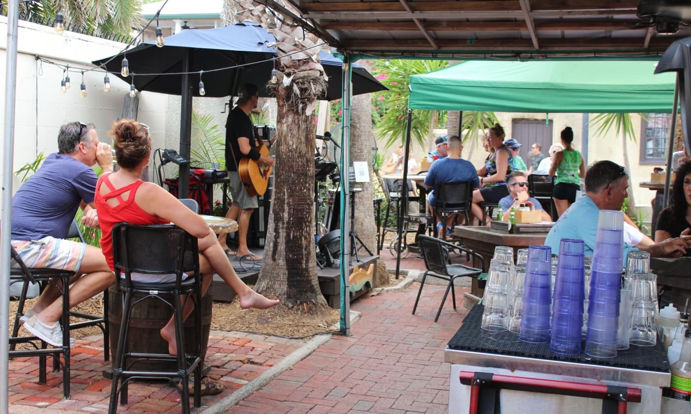 Listening to live music at the Backyard at Meehan's Island Cafe