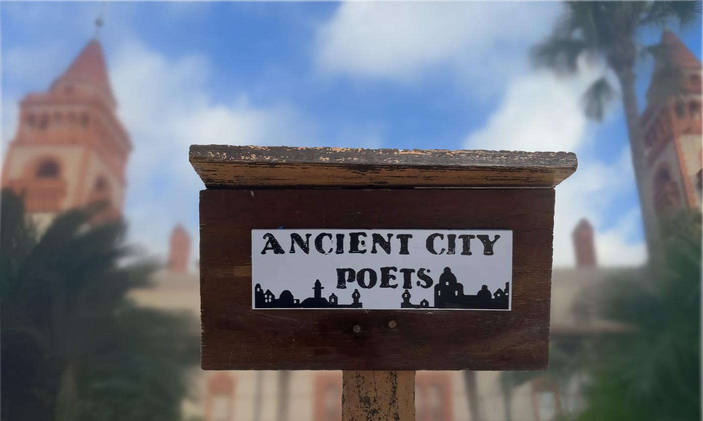 A podium that reads "Ancient City Poets" overlayed on a fuzzy image of the Ponce de Leon Hotel at Flagler College.