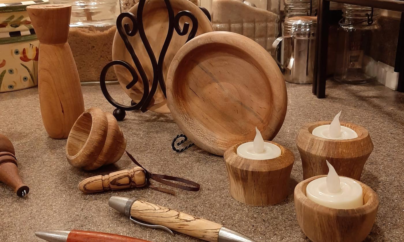 An assortment of handcrafted wood items laid out on the table