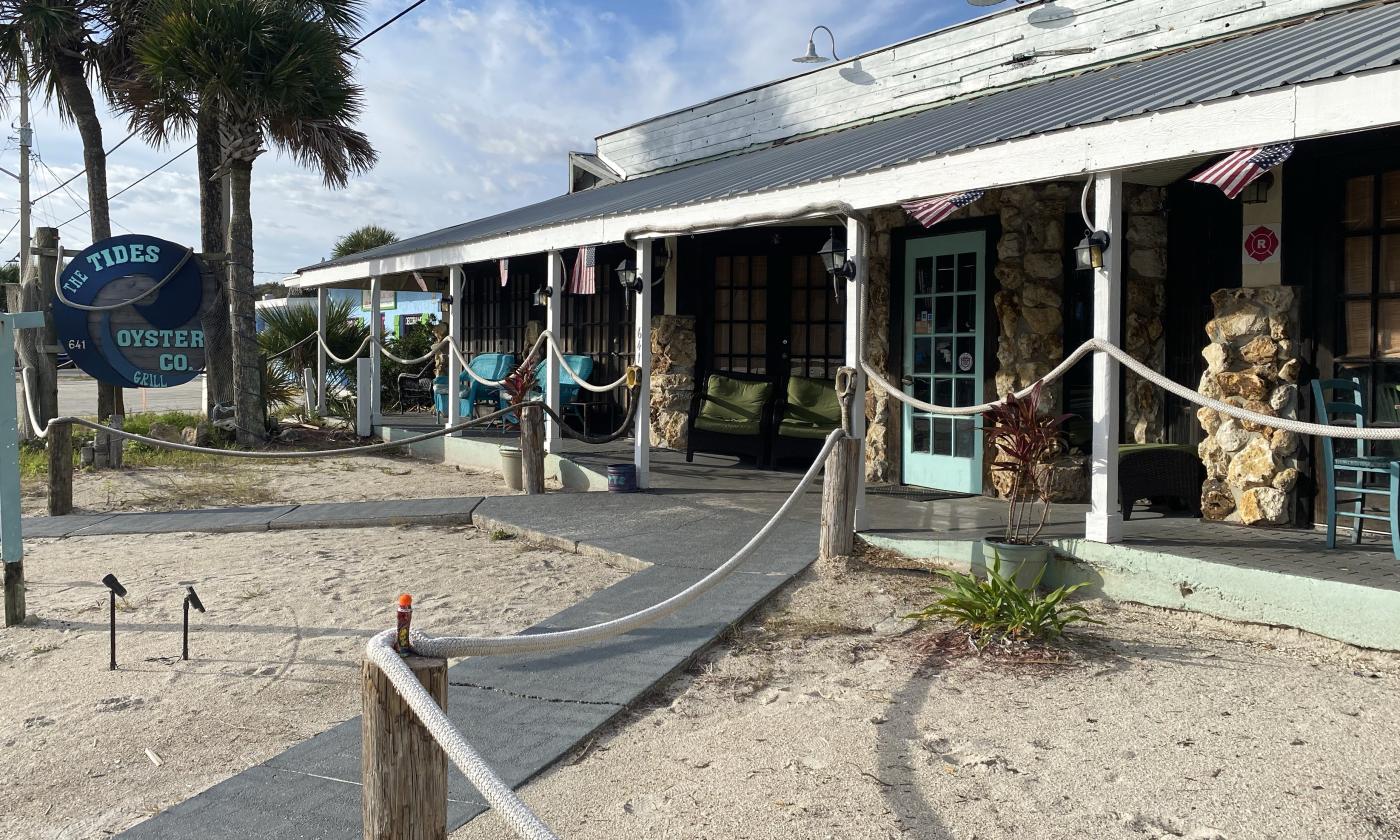 The exterior of The Tides Oyster Co. & Grill building