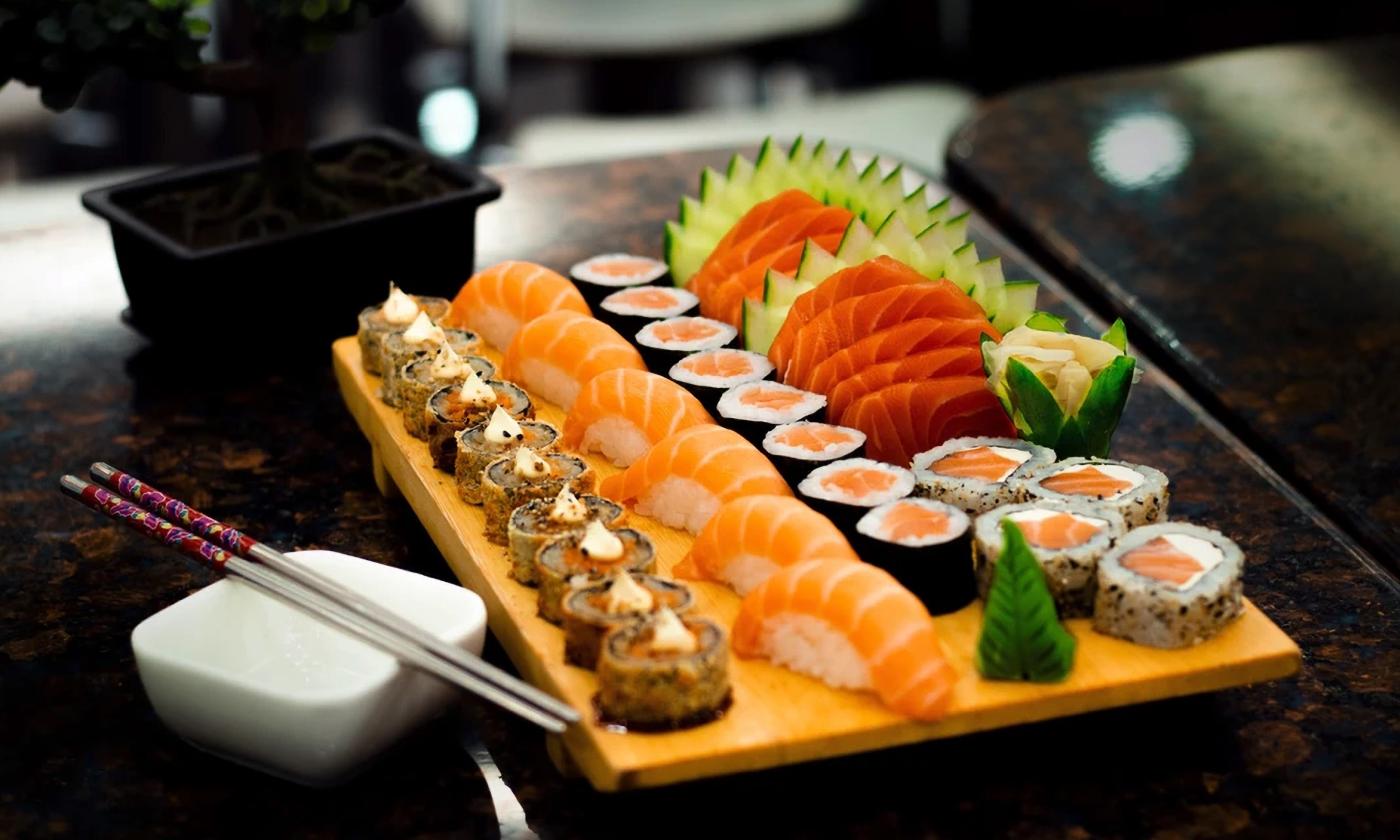 A spread of authentic and fresh sushi with chopsticks on the side