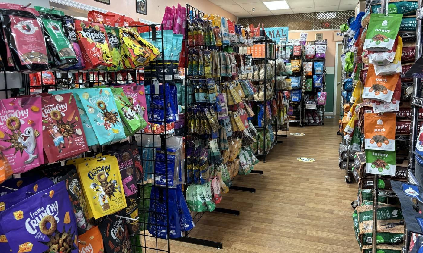 An aisle of various pet snacks and treats