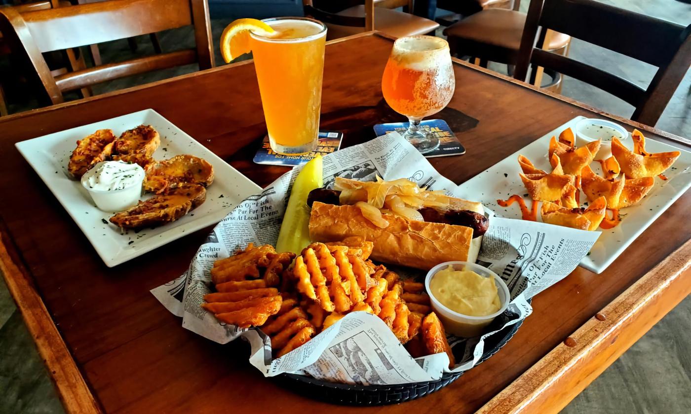 Plates of Candlelight South's food and alcoholic beverages