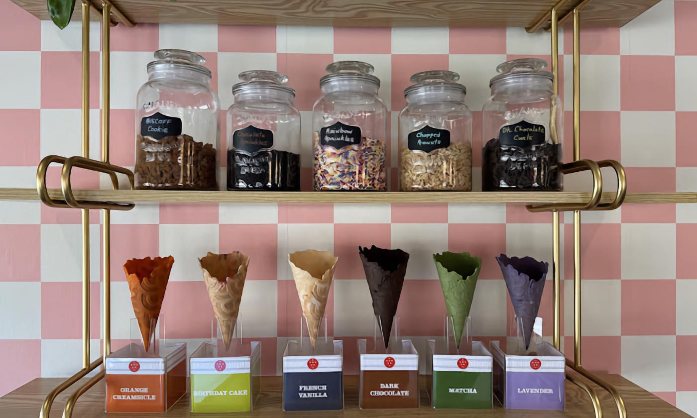 The waffle cones and toppings on display inside the shop