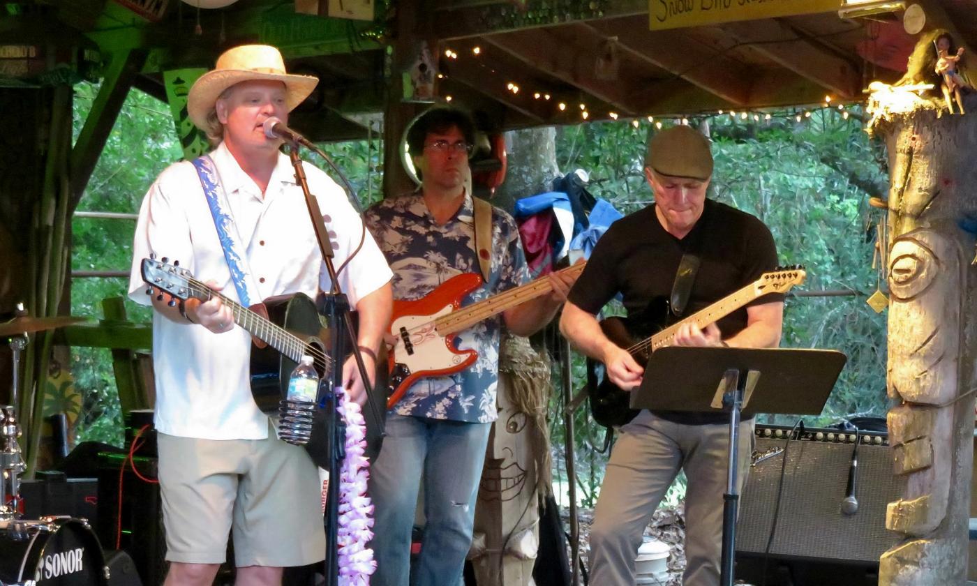 Jimmy Parrish and The Waves performing at a tiki themed restaurant