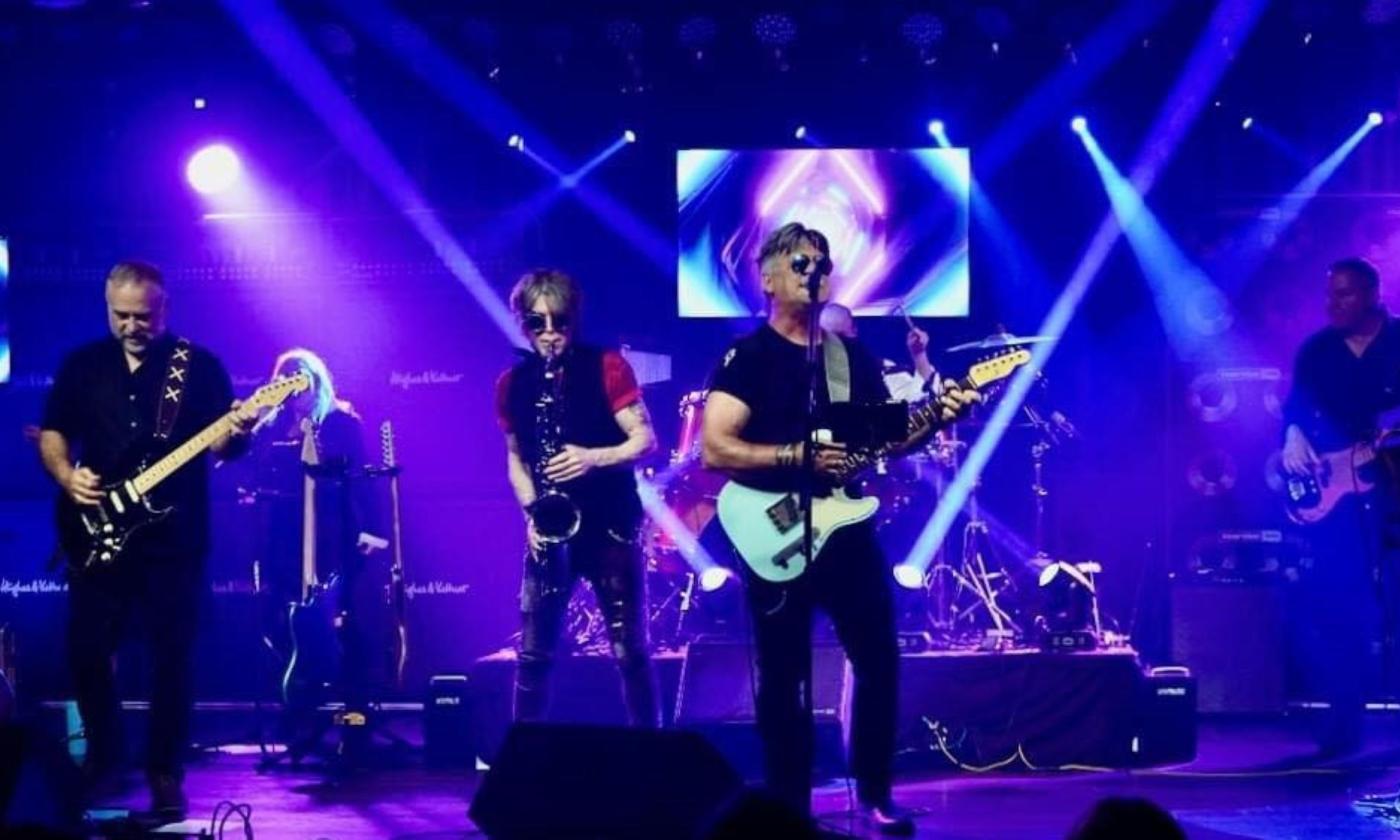 The Ultimate Floyd Tribute Band performs live on stage.