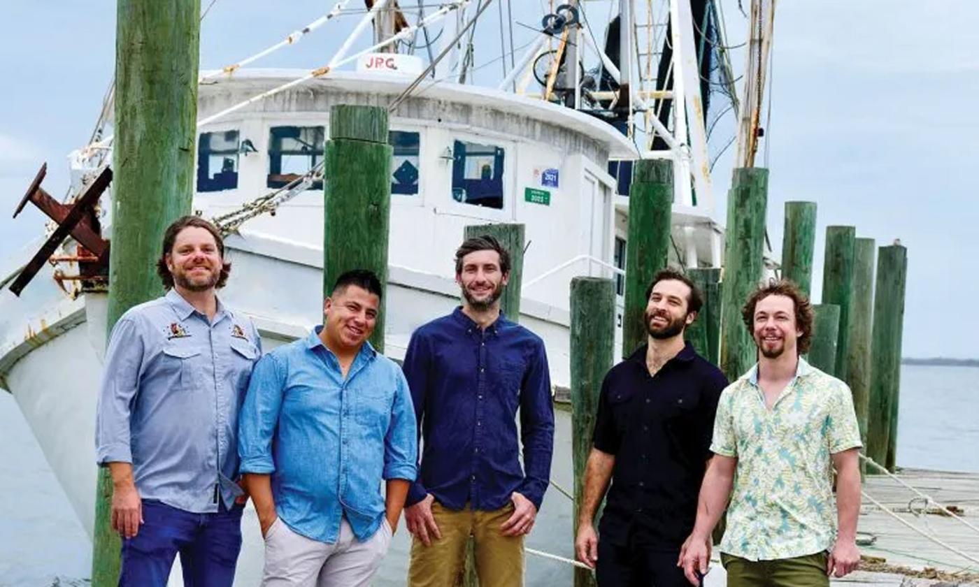 The band Gilberto '77 on the deck of a shrimp boat