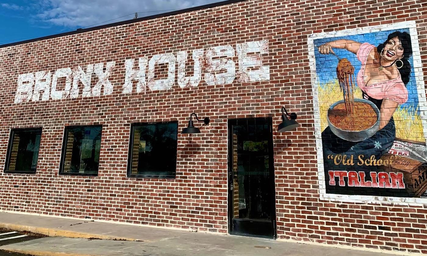 The brick exterior of Bronx House Pizza