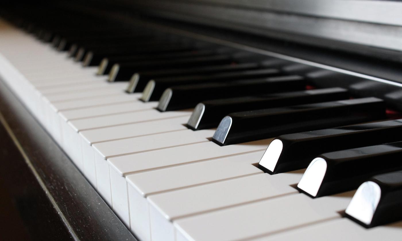 The keys of a piano stretch from upper left to lower right