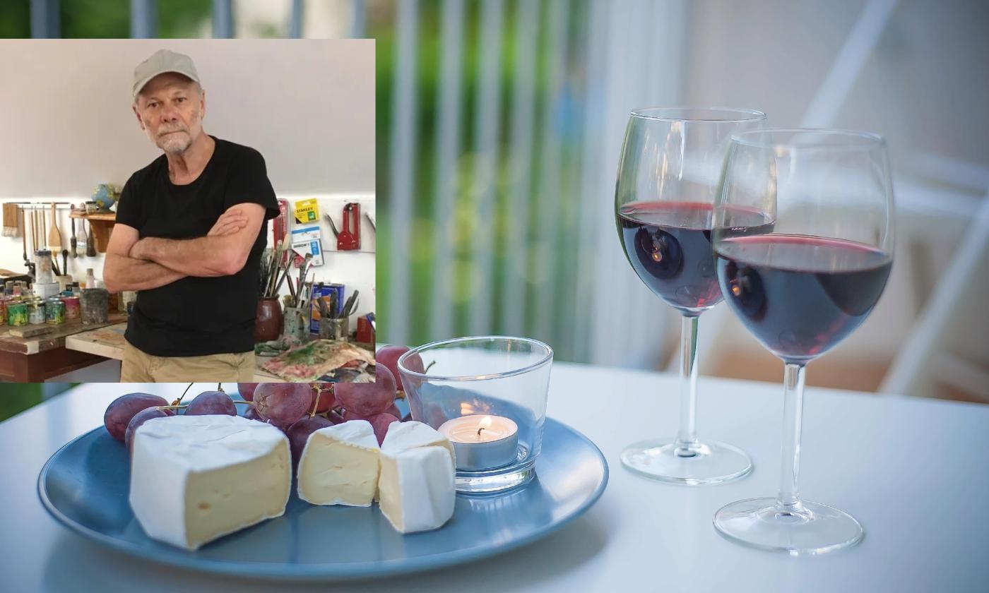 Wine and cheese on a table, with an inset of a visual artist among his paints