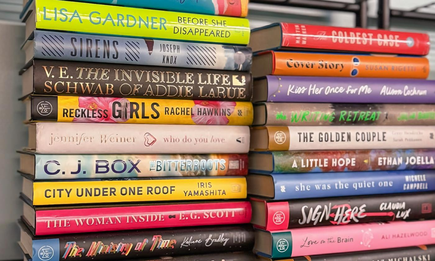 Stacks of books on a shelf