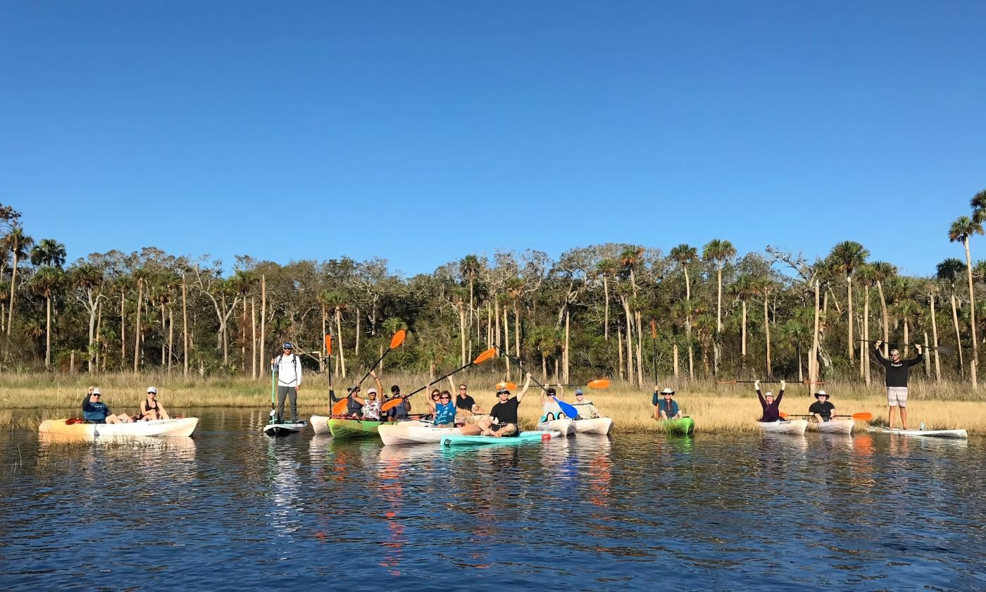 A group of kayakers near an inland beach in northeast Florida