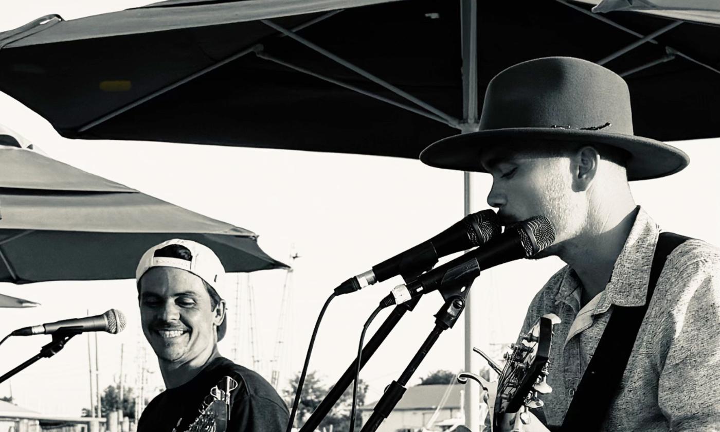 Ragga Surf Music playing onstage, outdoors