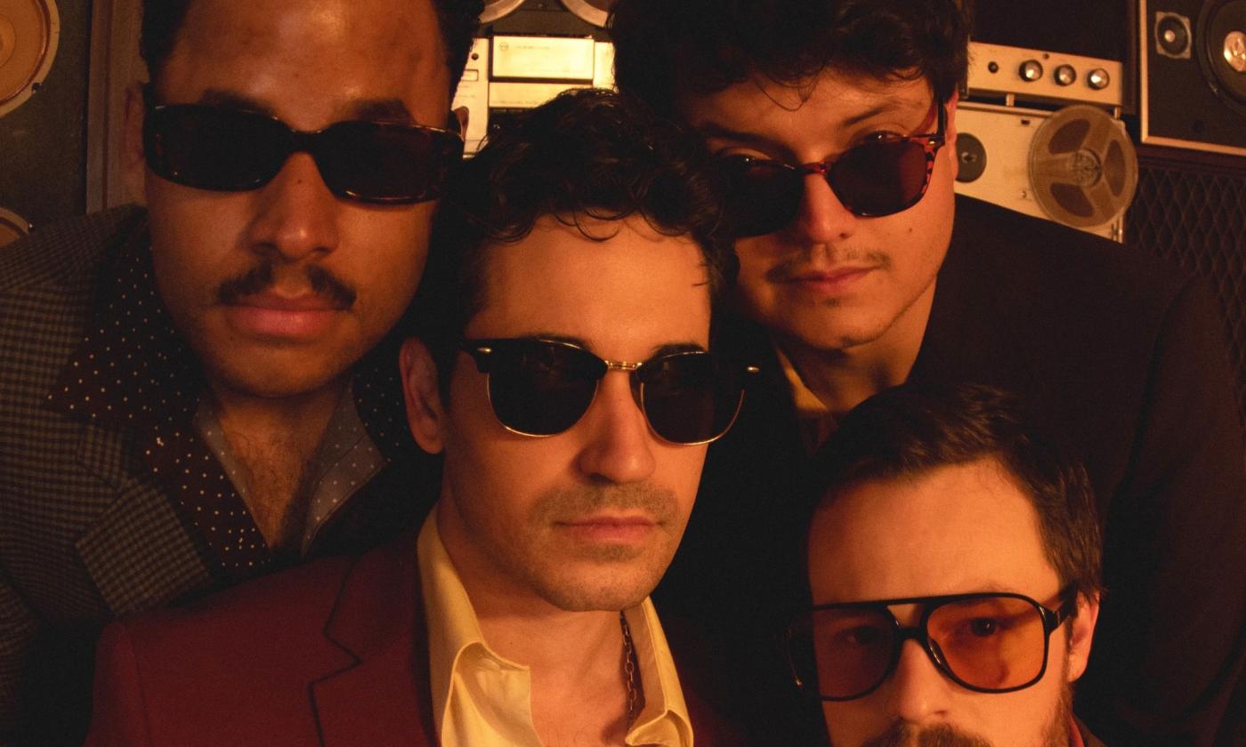 Headshot of the band Treis & Frineds, standing together.