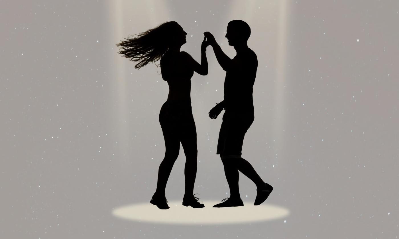 Partners rumba dancing together