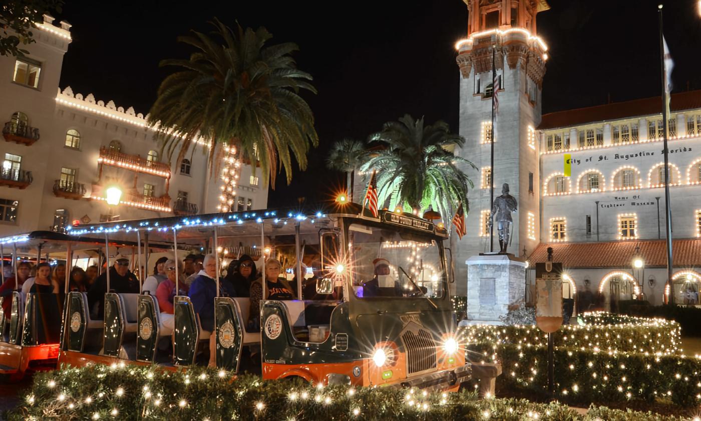 An Old Town Trolley, decorated for Nights of Lights in front of the Lightner