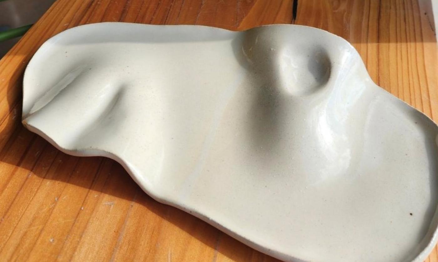 A clay charcuterie board