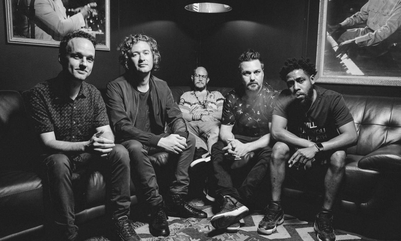 The five-member band, Toubab Krewe, on a sofa