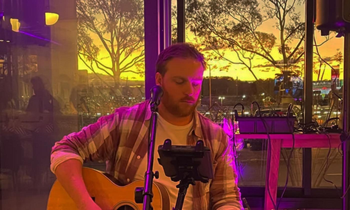 Musician Scott Halls onstage singing