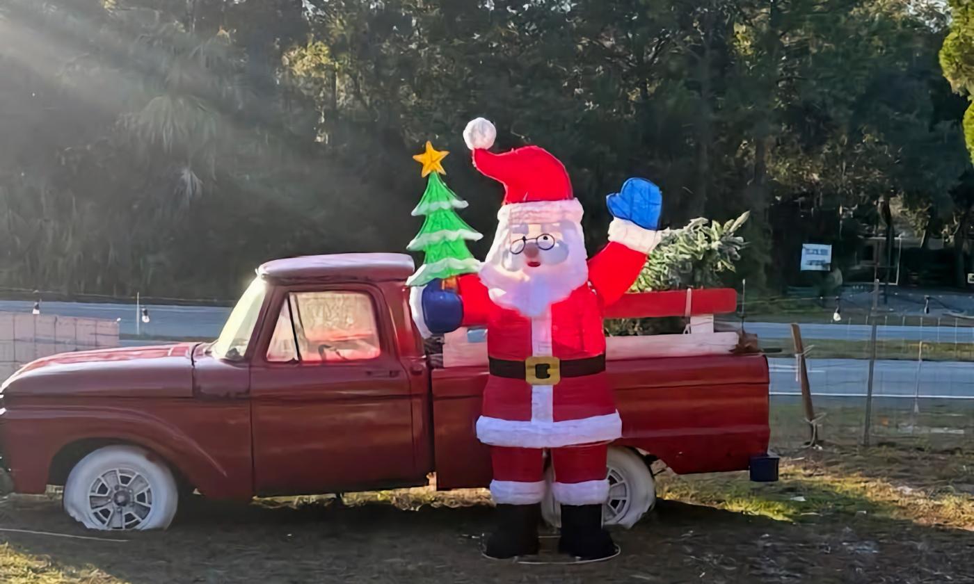 A red truck and Santa blow-up in front of Shantytown Village