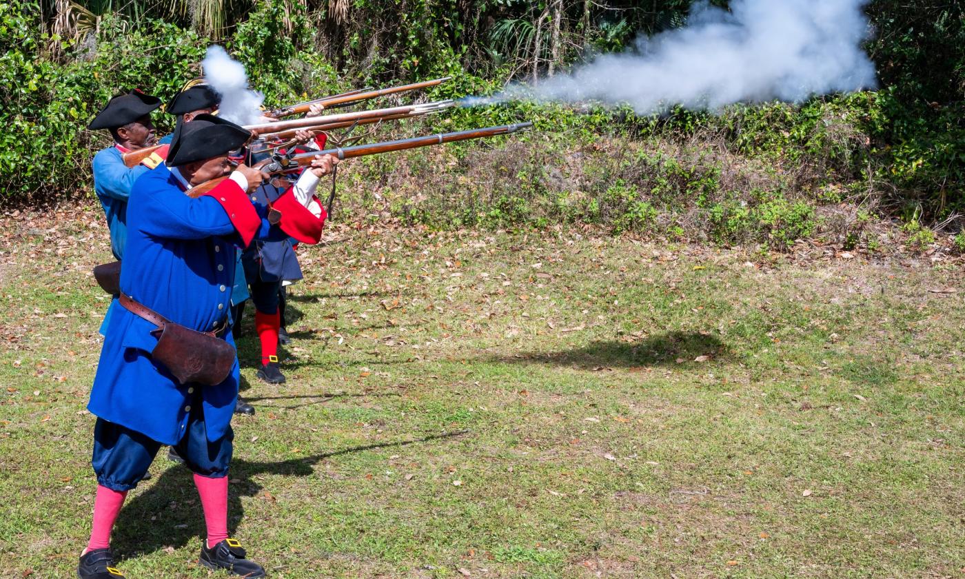 Fort Mose muster with the militia firing guns