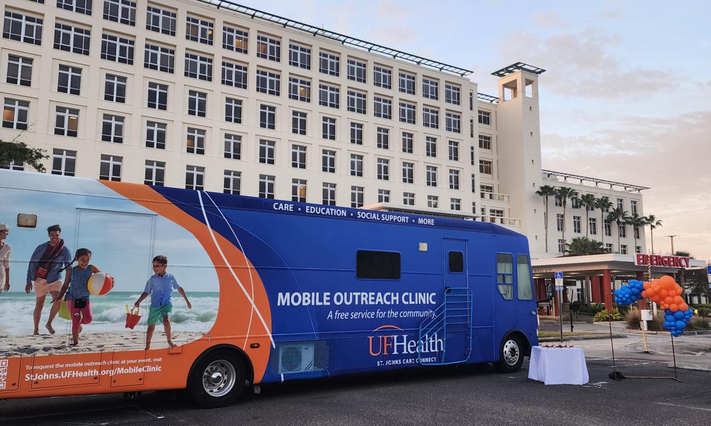 The UF Care bus and race table at Flagler Hospital for the 5K