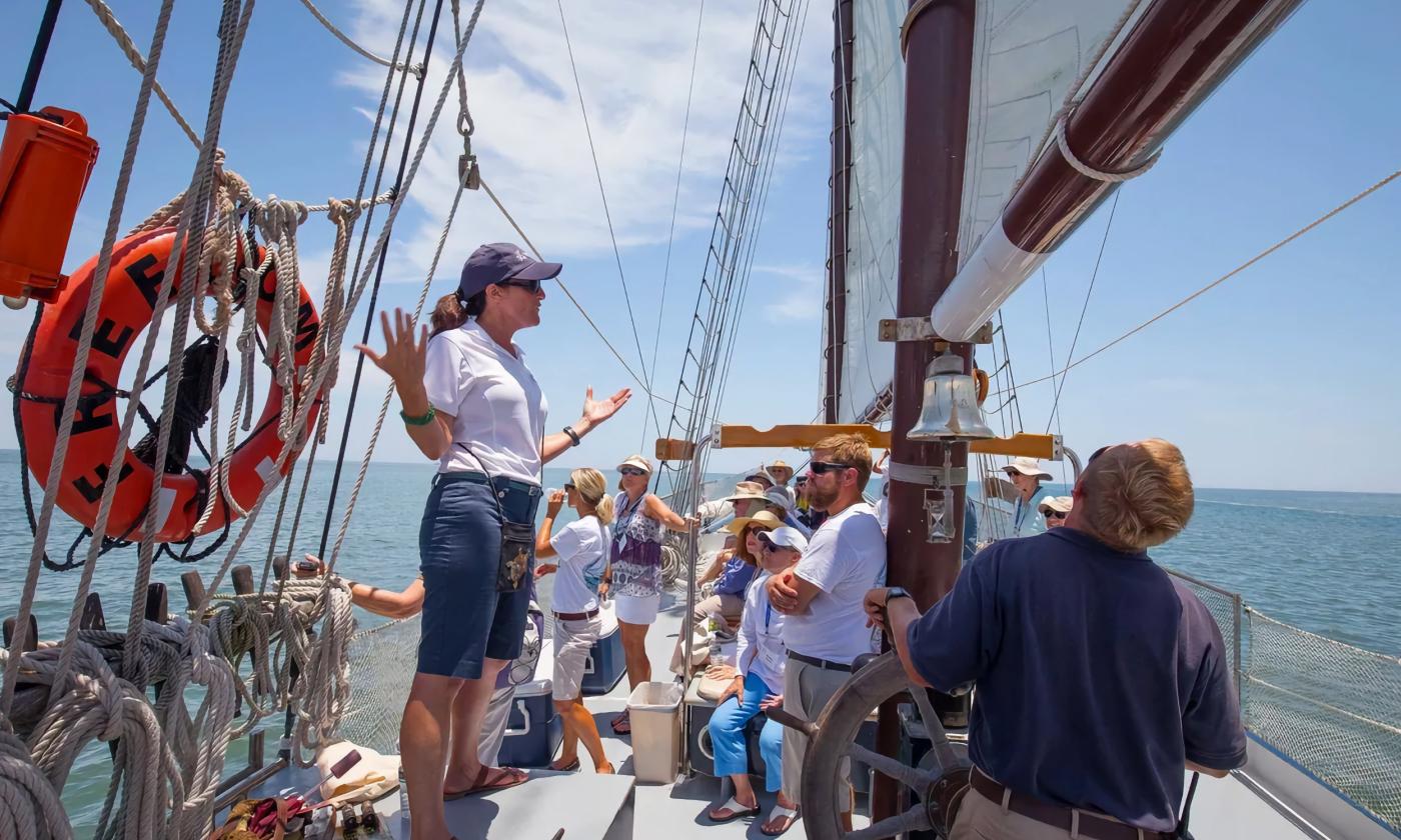 A guide teaching aboard a boat