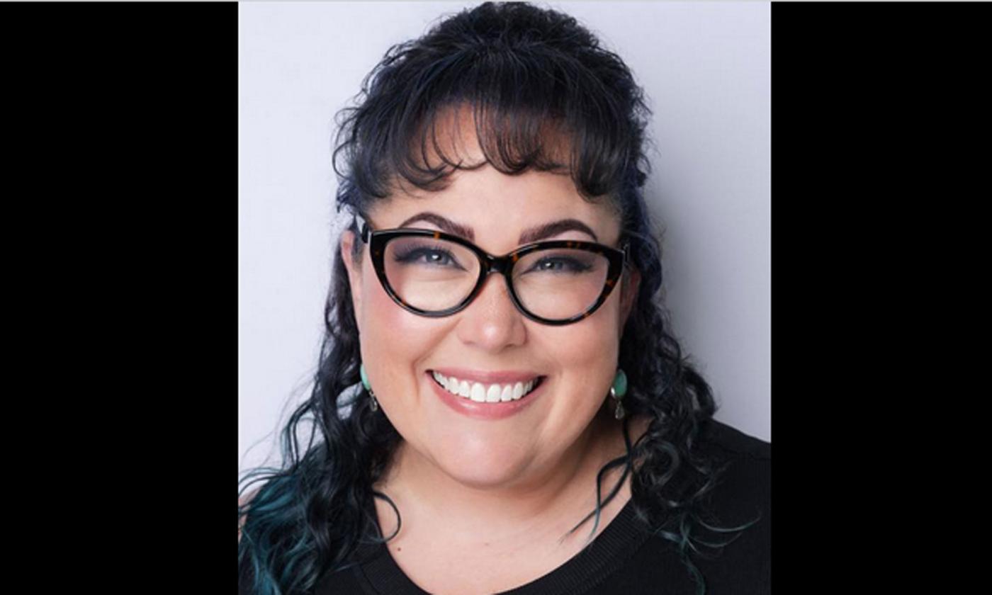 Pianist Aaron Decicco smiling at the camera