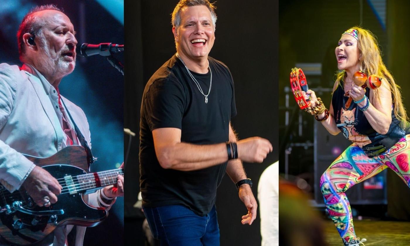 Bandmates from Men at Work perform on stage.