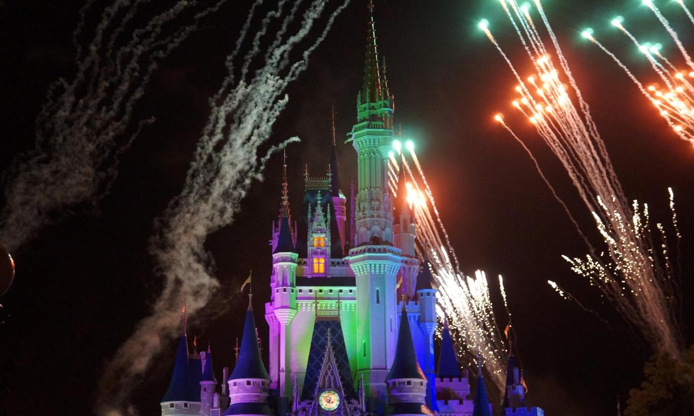 A storybook castle being lit by fireworks