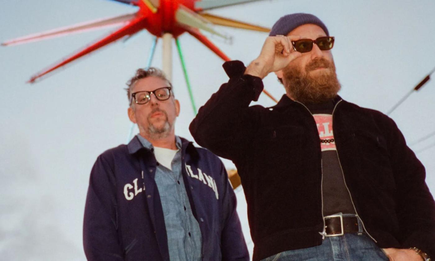 Bandmates from the Black Keys pose for fans. 