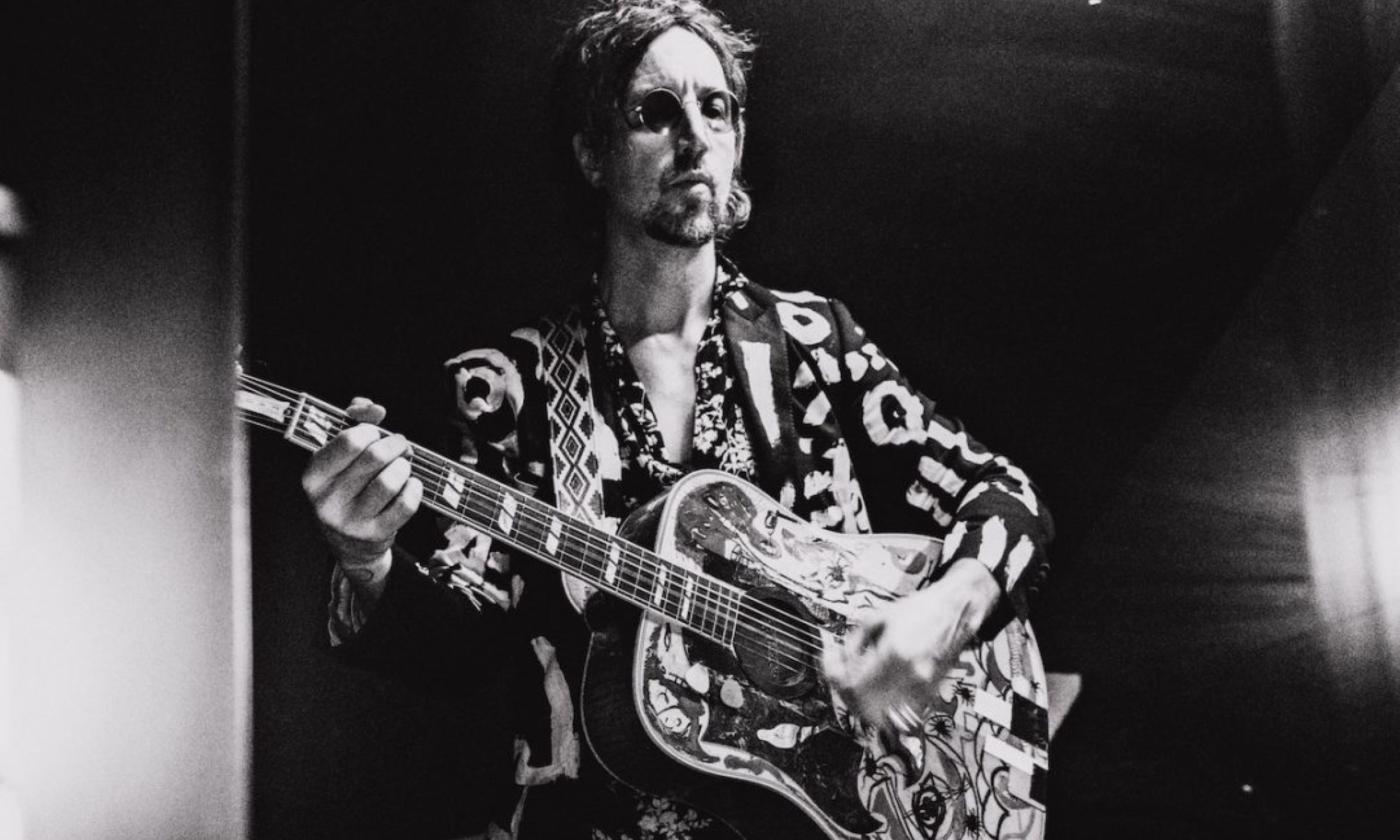 Joseph Arthur performs with his guitar.