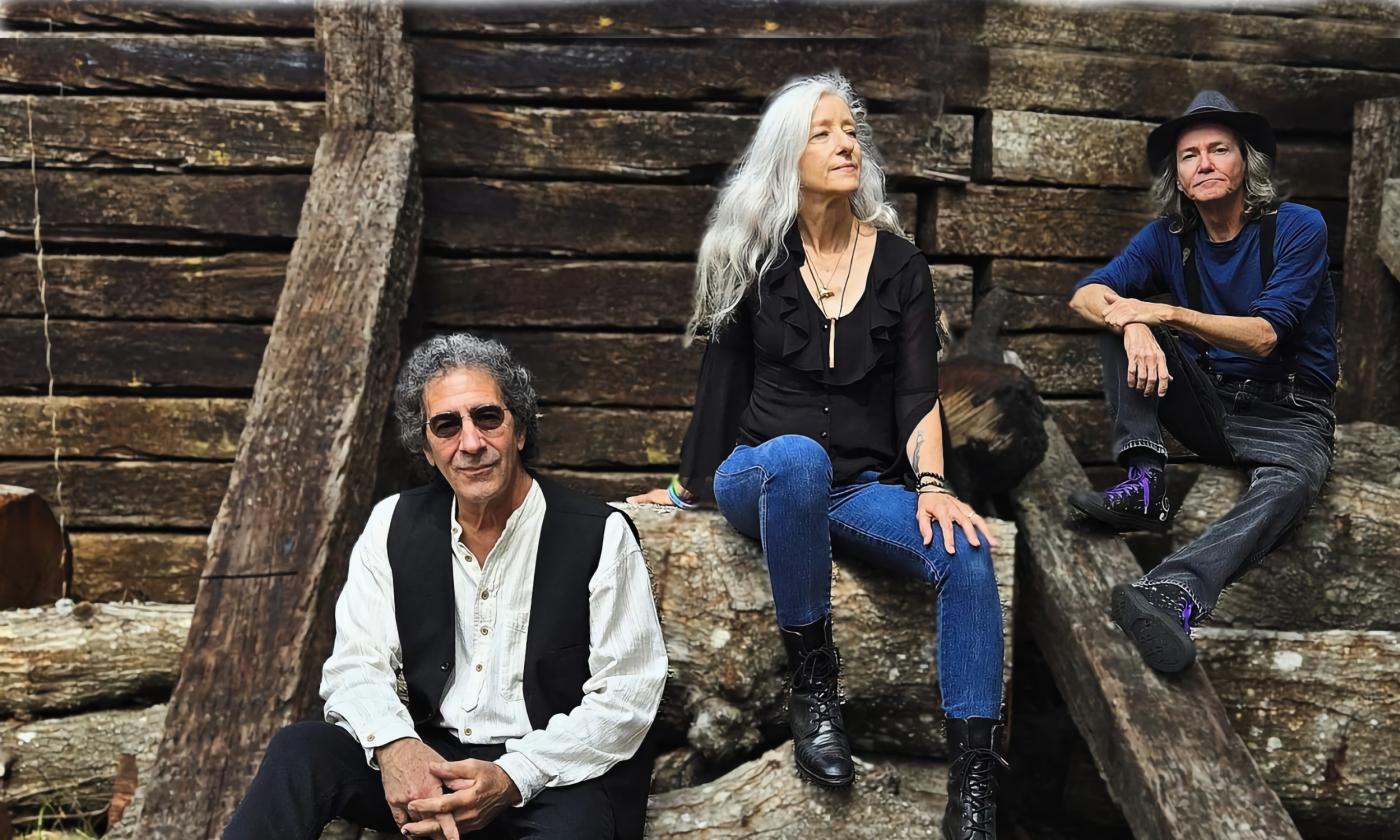 The three-member band Celtic Cunundrum in a ruins in Scottland